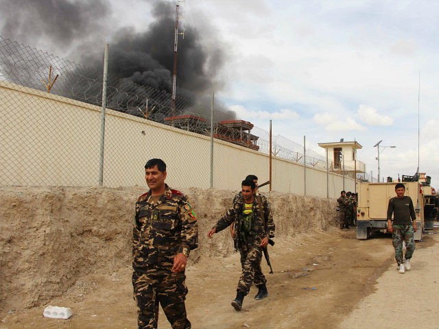 FILE -- In this March 9, 2016 file photo, smoke rises from a building, where Taliban insur