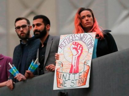 Hundreds protest at a vigil for refugees on Monday, Jan. 30, 2017 in Dallas, Texas at Than