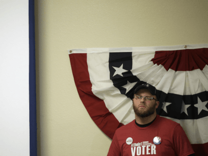 JANUARY 30: A man in a Atheist tee shirt listens as Republican presidential candidate Jeb