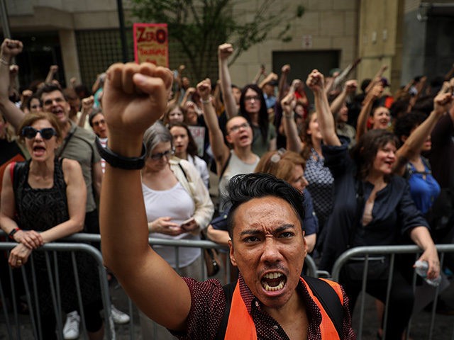 NEW YORK, NY - JUNE 20: Activists shout toward the U.S. Mission to the United Nations whil