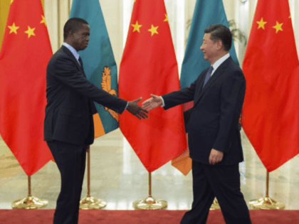 Zambia’s President Edgar Lungu, left, shakes hands with China’s President Xi Jinping,