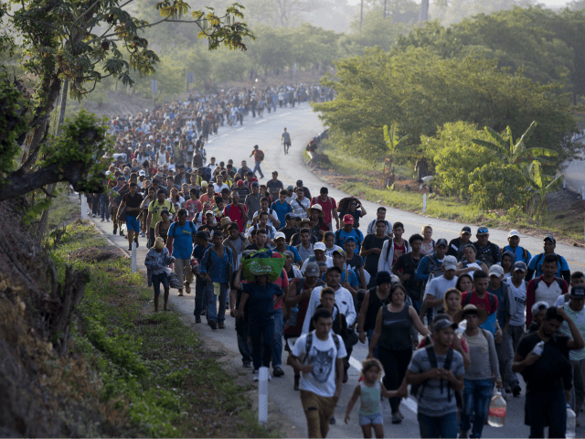 FILE - In this April 20, 2019, file photo, Central American migrants, part of a caravan ho
