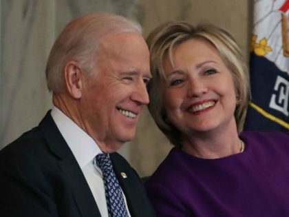 Former US Secretary of State, Hillary Clinton shares a laugh with US Vice President Joseph