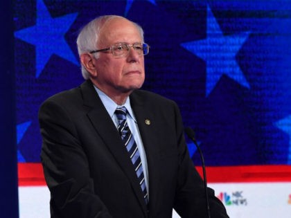 Democratic presidential hopeful former US Senator for Vermont Bernie Sanders looks on duri