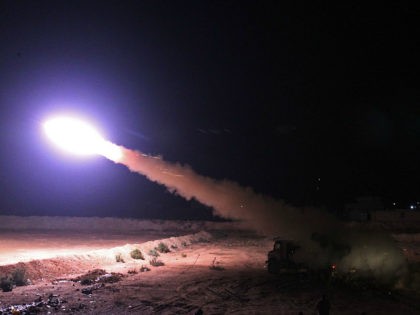 TOPSHOT - Iraqi paramilitary units from the Hashed al-Shaabi fire rockets from the Iraqi c