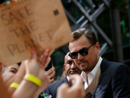 US actor Leonardo DiCaprio signs autographs as he arrives for the German Premiere of US di