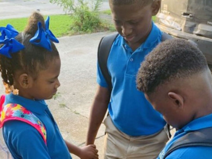 Jamisha Harris shared a photo of her children Eugene Jacobs, 10, Jorden Jacobs, 8, and Emi