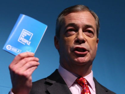 LONDON, ENGLAND - NOVEMBER 22: Brexit Party leader Nigel Farage holds up his 'contract wit