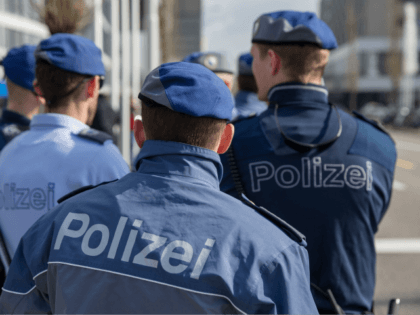 ZURICH, SWITZERLAND - FEBRUARY 26: Police officers stand outside of the Extraordinary FIFA