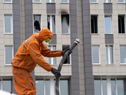 A Russian Emergency Situation worker attends the scene of a fire at St. George Hospital in