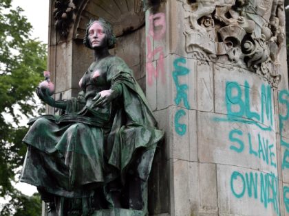 A statue of Britain's Queen Victoria stands defaced in Woodhouse Moor Park in Leeds, north