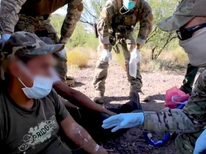 Border Patrol BORSTAR agents from the El Centro Sector provide medical assistance to dehyd