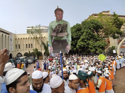 Supporters of Islami Andolan Bangladesh, an Islamist political party, carry a cutout of Fr