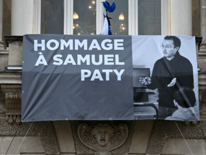 TOPSHOT - A portrait of French teacher Samuel Paty is displayed on the facade of the Opera
