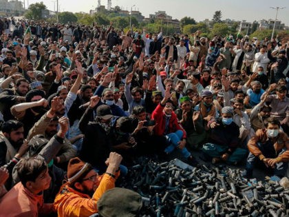 Activists and supporters of Tehreek-e-Labbaik Pakistan (TLP), a religious party, shout slo