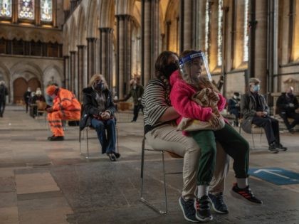 SALISBURY, ENGLAND - FEBRUARY 11: Mum Jade, waits with her daughter Lola after receiving h