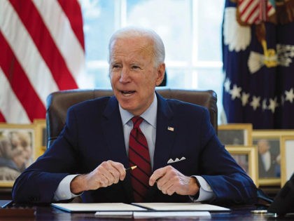 President Joe Biden signs a series of executive orders on health care, in the Oval Office
