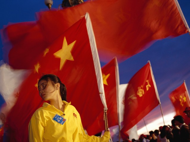 Spectators and participants fill Tiananmen Square during 50th anniversary celebration for the founding of the People's Republic of China. The annual National Day holiday takes place on October 1st. (Photo by David Butow/Corbis via Getty Images)