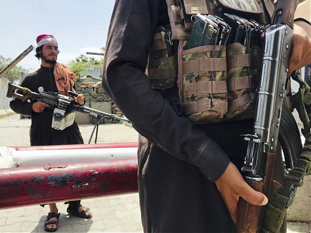 Taliban fighters stand guard at a checkpoint near the US embassy that was previously manned by American troops, in Kabul, Afghanistan, Tuesday, Aug. 17, 2021. The Taliban declared an "amnesty" across Afghanistan and urged women to join their government Tuesday, seeking to convince a wary population that they have changed a day after deadly chaos gripped the main airport as desperate crowds tried to flee the country. (AP Photo)