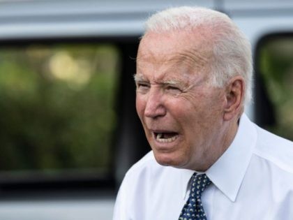 US President Joe Biden speaks next to a Jeep Wrangler Rubicon 4xe after delivering remarks