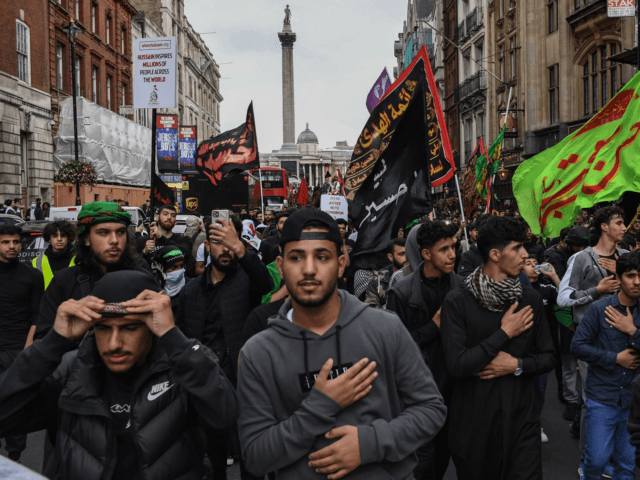 Shiite Muslims take part in the annual 'Ashura Day' march in central London on August 19,