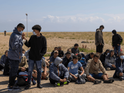 DUNGENESS, ENGLAND - AUGUST 04: A group of around 40 migrants arrive via the RNLI (Royal N