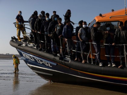 DUNGENESS, ENGLAND - SEPTEMBER 07: A group of migrants arrive via the RNLI (Royal National
