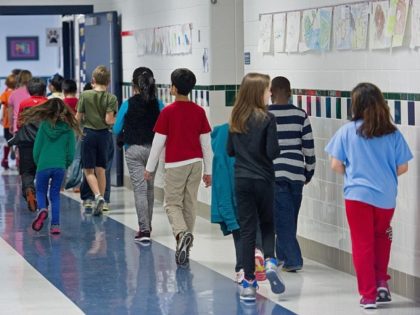 Students walking the hallways are seen February 21, 2014, at Steuart W. Weller Elementary
