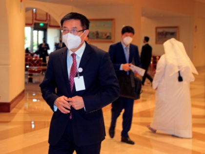 China's special envoy to Afghanistan, Yue Xiaoying, left, arrives for talks to see how to