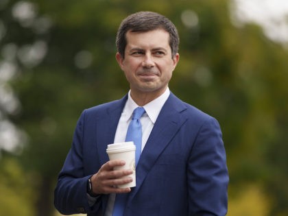 Transportation Secretary Pete Buttigieg arrives for a television interview with CNBC outsi