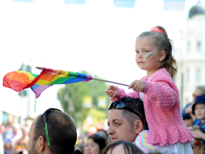 BRIGHTON, ENGLAND - AUGUST 01: A young girl watches the parade during Brighton Pride 2015