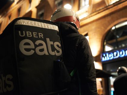 An Uber Eats worker wait in front of a McDonalds for his order. Food delivery industry has