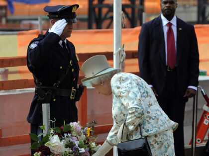 Queen Elizabeth II of England lays a wreath as she pays tribute to the victims of the 9/11