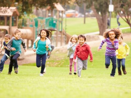 children running and playing at park