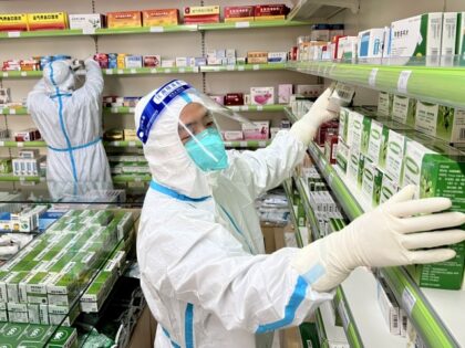 ZHENGZHOU, CHINA - NOVEMBER 06: Staff members wearing personal protective equipment (PPE)