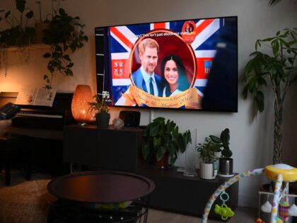 TOPSHOT - A woman poses as she watches an episode of the newly released Netflix docuseries