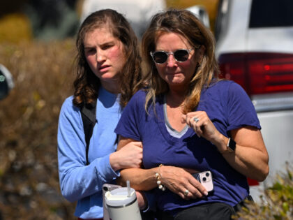 A family leave a reunification site in Nashville, Tenn., Monday, March 27, 2023 after seve