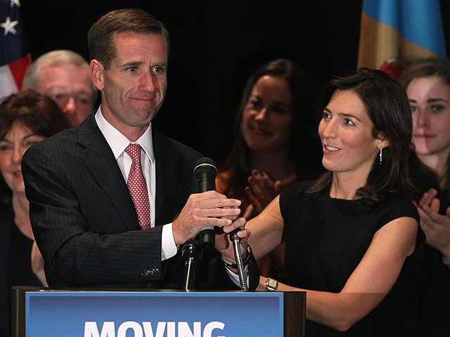 Attorney General Beau Biden (L) celebrates his win with his wife Hallie Biden during a vic