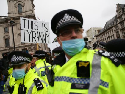 An activist protesting against coronavirus lockdown restrictions and any mandated covid-19