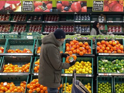 A customer shops for food items inside a Tesco supermarket store in east London on January