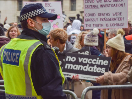 LONDON, UNITED KINGDOM - 2022/01/22: A police officer observes demonstrators during the pr
