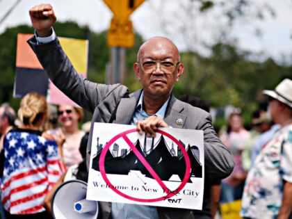 City Council candidate Bernard Chow demonstrates during a rally in opposition to the propo