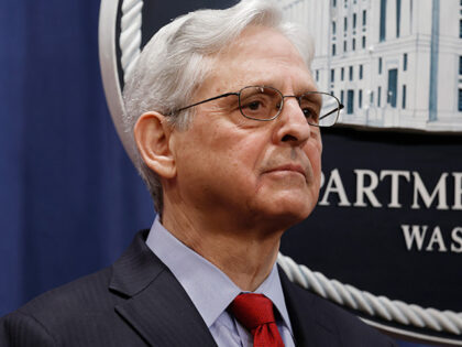 U.S. Attorney General Merrick Garland listens as Deputy Attorney General Lisa Monaco speak