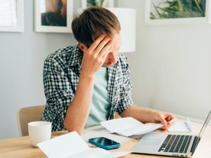 Inflation - Pensive male thinking about high prices. Managing family finances. Rise of uti