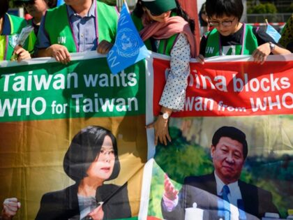 Pro-Taiwan protesters demonstrate outside of the United Nations offices on the opening day