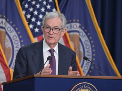 Chair Powell answers reporters' questions at the FOMC press conference on December 18