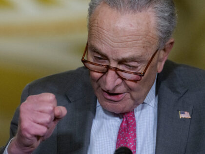 Senate Minority Leader Chuck Schumer, D-N.Y., responds to questions from reporters during