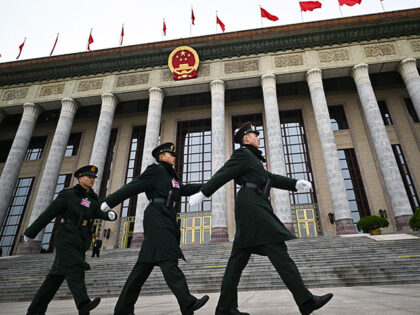 Chinese People's Liberation Army (PLA) soldiers patrol outside the Great Hall of the Peopl