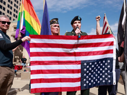 INDIANANAPOLIS, INDIANA, UNITED STATES - 2025/03/14: Protesters hold an upside down Americ