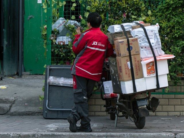 A delivery worker outside a JD.com Inc. sorting center in Shanghai, China, on Friday, Apri